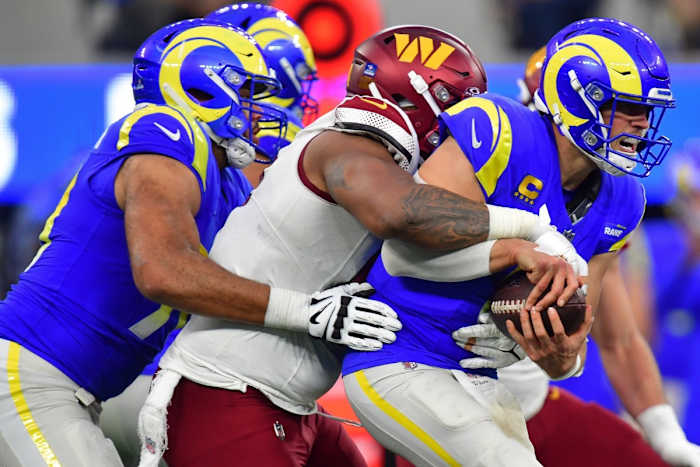 Dec 17, 2023; Inglewood, California, USA; Washington Commanders defensive tackle Daron Payne (94) brings down Los Angeles Rams quarterback Matthew Stafford (9) during the second half at SoFi Stadium.